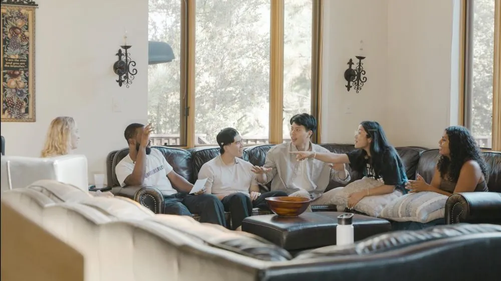 Campers sharing in the living room